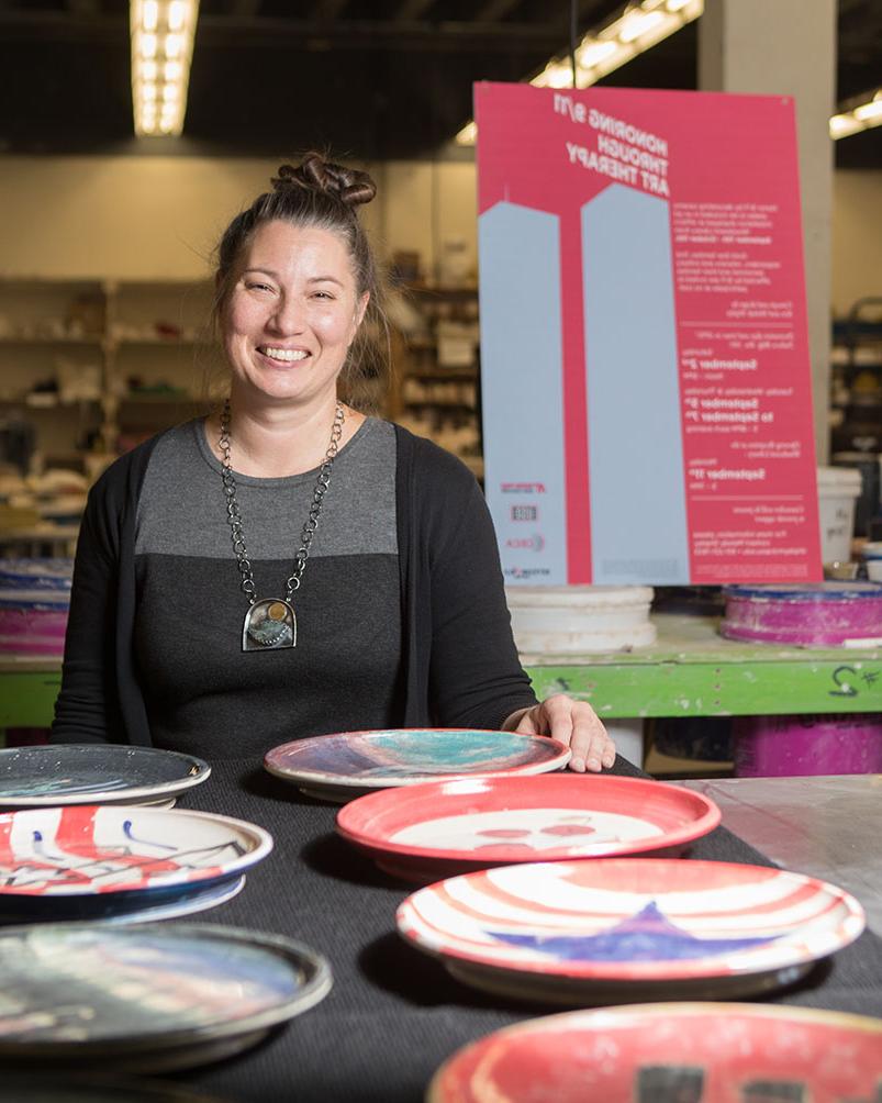 Melody Shipley poses for photo in ceramics studio