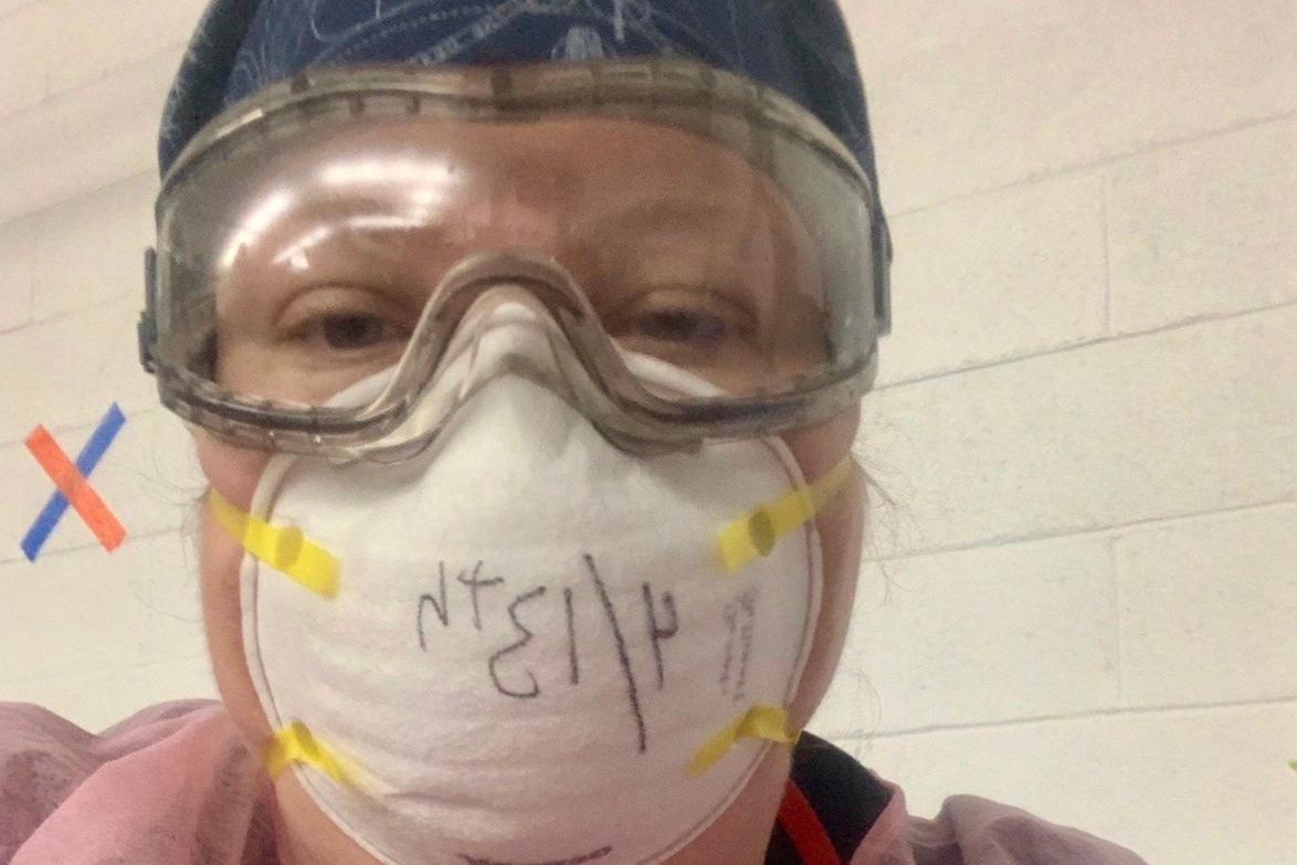 Sarah Sullivan poses with mask in hospital